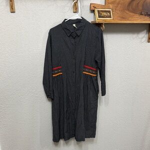 Elegant Long Sleeve Black Dress with Red and Orange Details